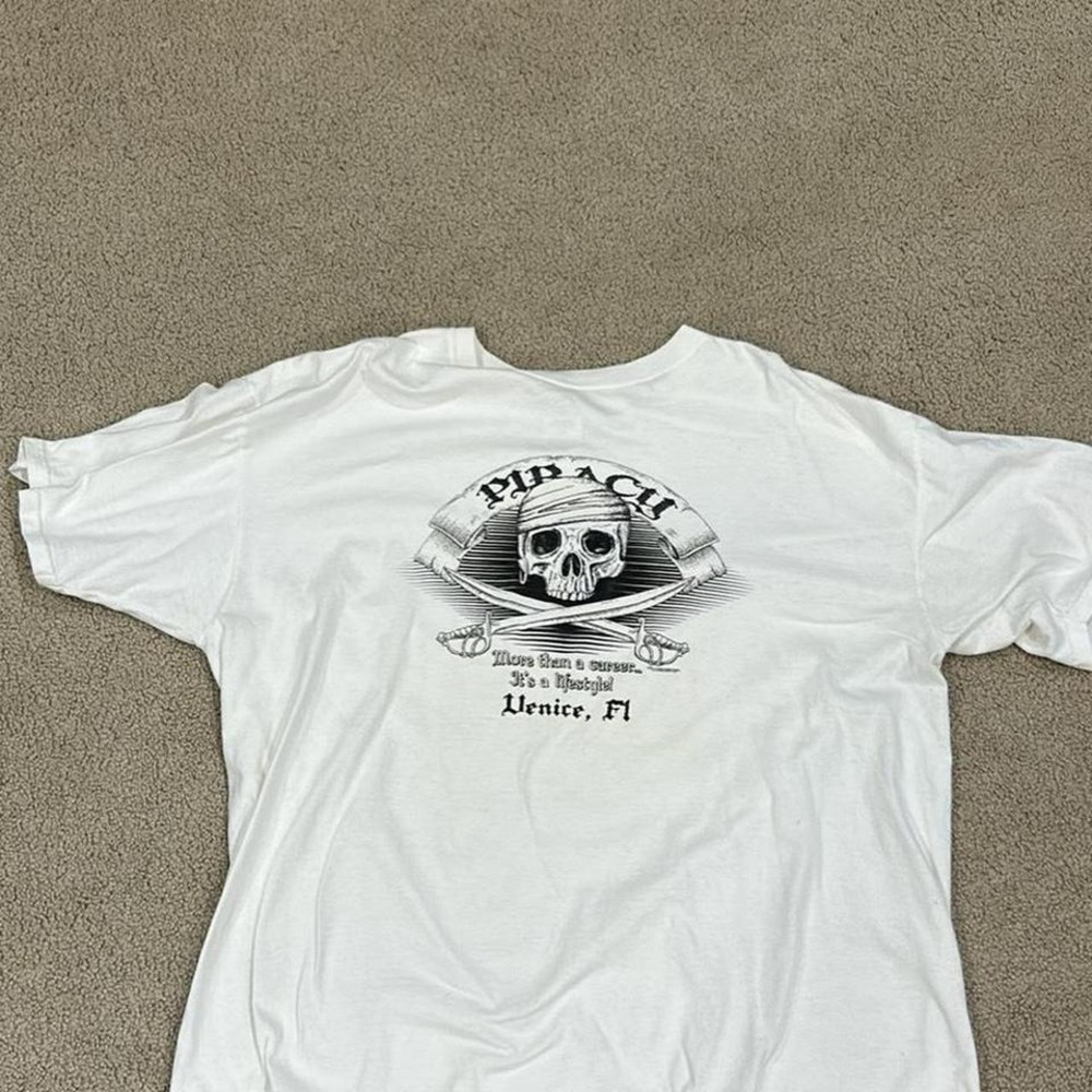 White and black graphic t-shirt with skull‎ and swords design Venice Florida
